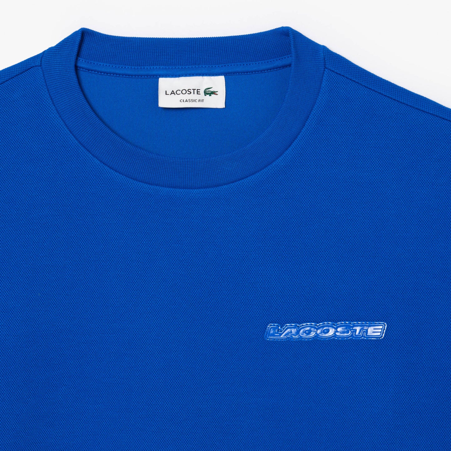 SUDADERA LACOSTE CON INSIGNIA SH2858-00-HJM